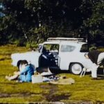 A thumbnail from a standard 8mm film of a couple taking a trip to Burnham Beeches in their Ford Anglia in the 1960s
