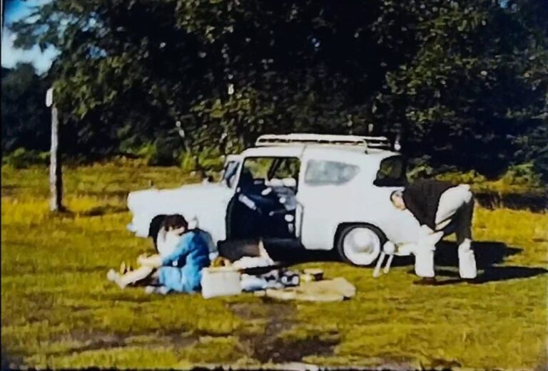 A thumbnail from a standard 8mm film of a couple taking a trip to Burnham Beeches in their Ford Anglia in the 1960s