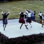A Still from a vintage home movie showing a set of highland games from the 1960s