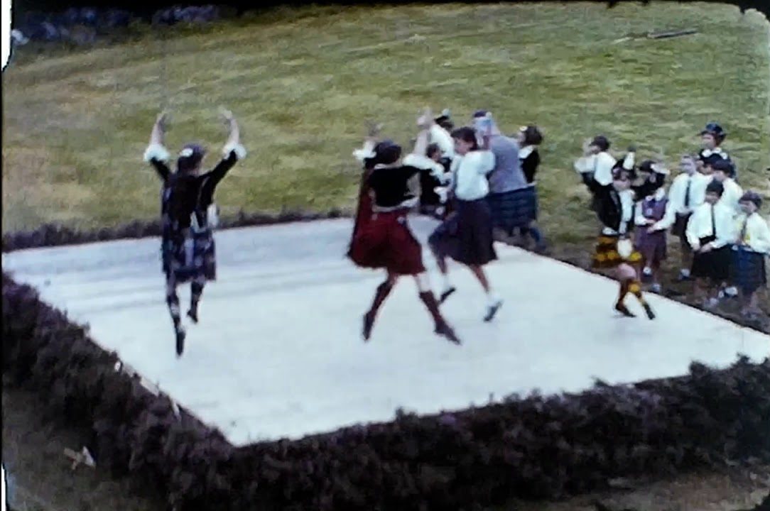 A Still from a vintage home movie showing a set of highland games from the 1960s