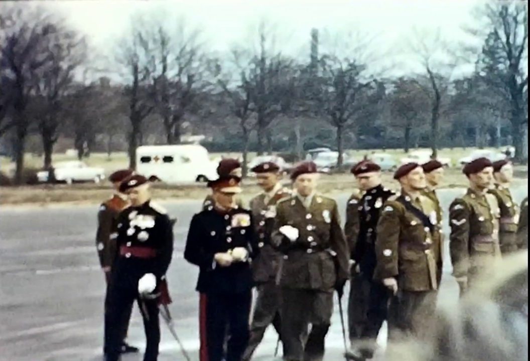 A still shot from a vintage home movie showing the opening ceremony of a new barracks for the Parachute Regiment in 1965