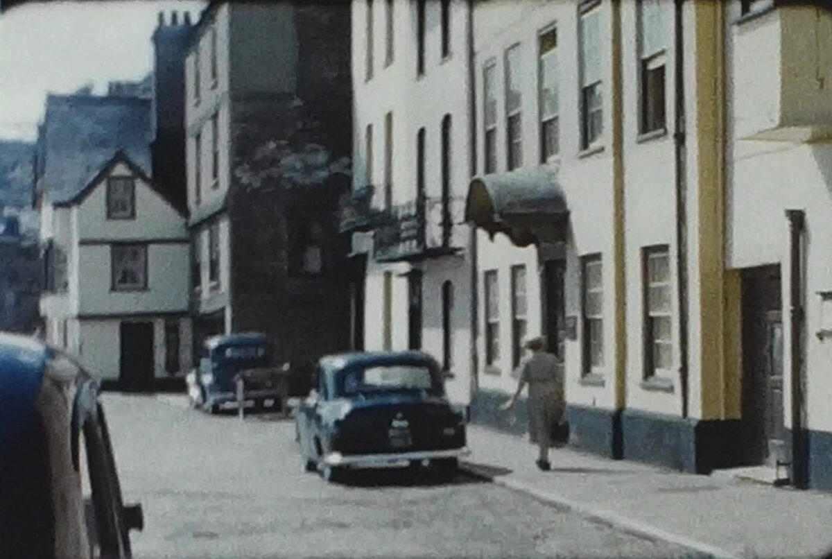 A still image from an 8mm vintage home movie of a seaside town in 1959