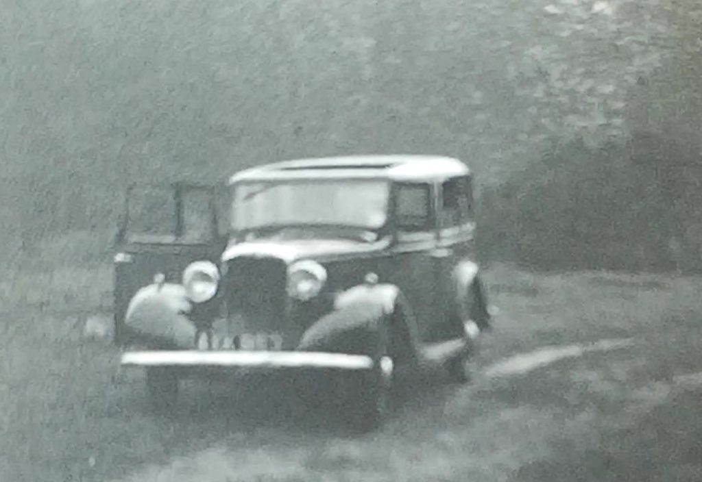 A still from a family home movie from the 1930s showing their car