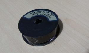 A reel of Standard 8 film which has been half exposed.