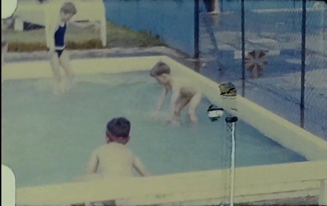A still image from a vintage home movie taken by a family enjoying a caravan holiday in the 1960s
