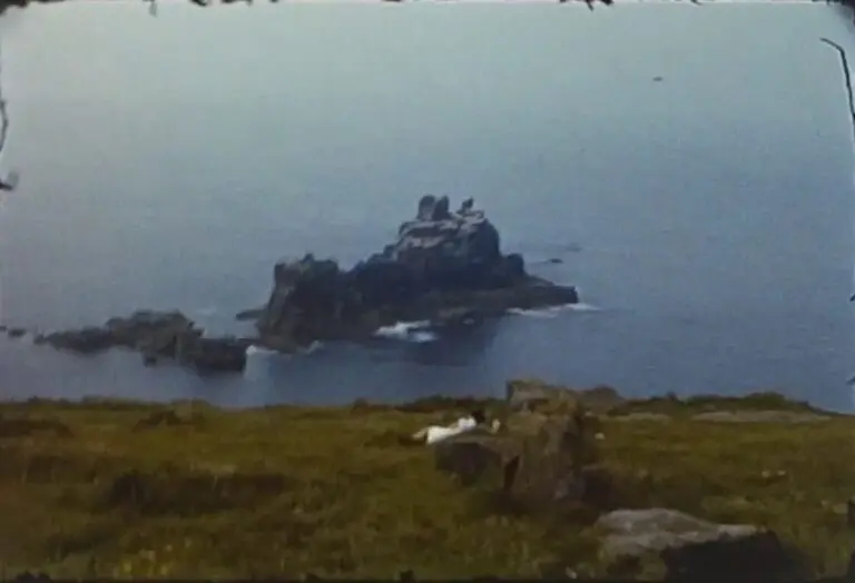 A still image showing a crop of rocks at Land's End from a vintage home movie taken in the 1960s