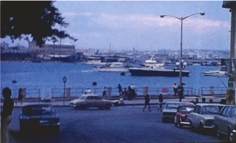 A picture of malta harbour taken from the land which is part of a vintage home movie of a Conference in Malta in 1971