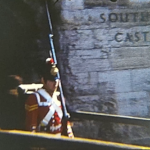 An image showing a man dressed in military uniform at Southsea Castle from a Vintage Home Movie of the 1970s