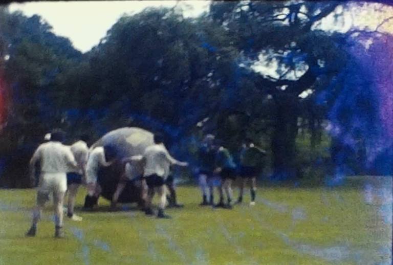 A screen shot from a vintage home movie showing go karting