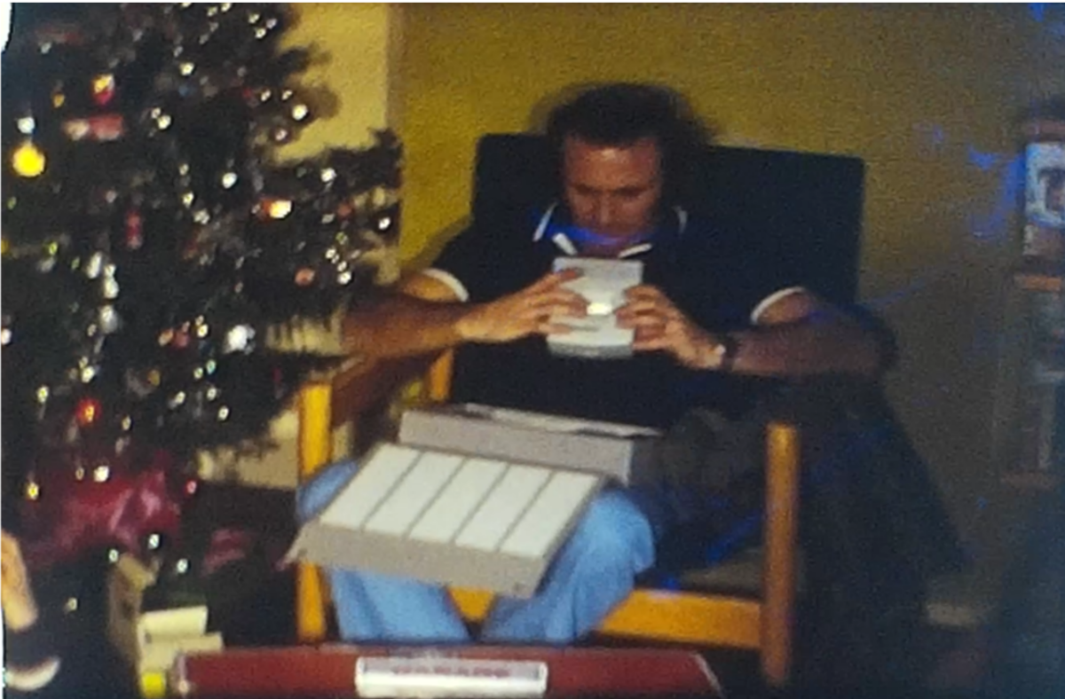 A still image from a vintage home movie showing a family Christmas at a house in Stevenage, Hertfordshire