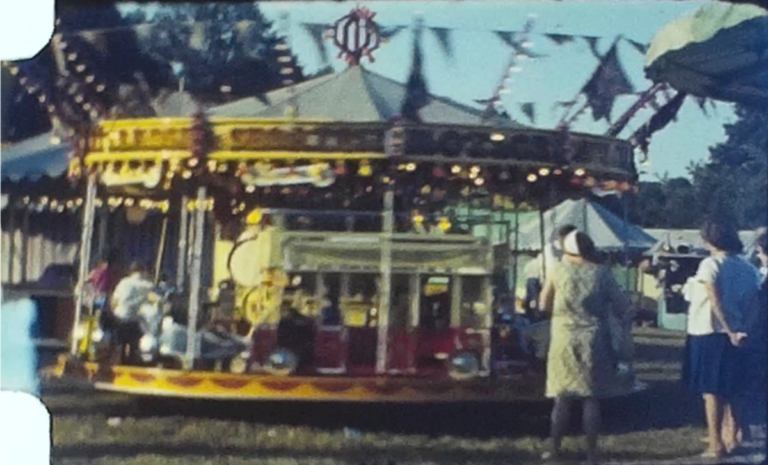 A still image from a vintage home movie shot at a steam fair and circus in 1964