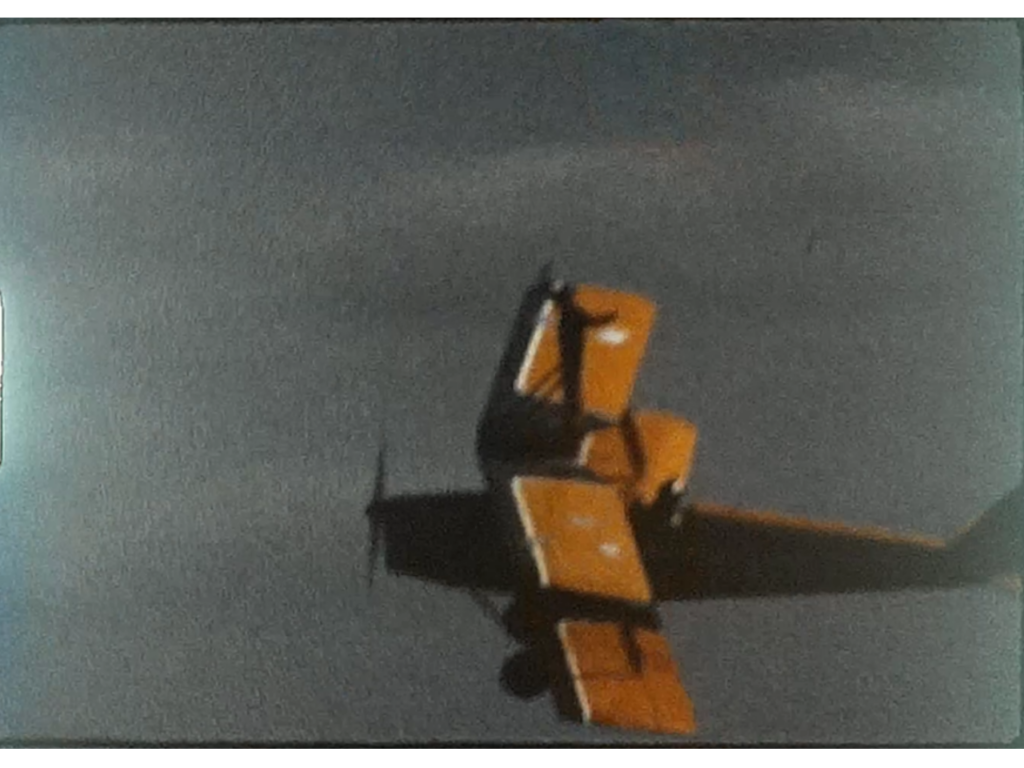 A still from a vintage home movie of a poorly exposed airshow film from the 1970s