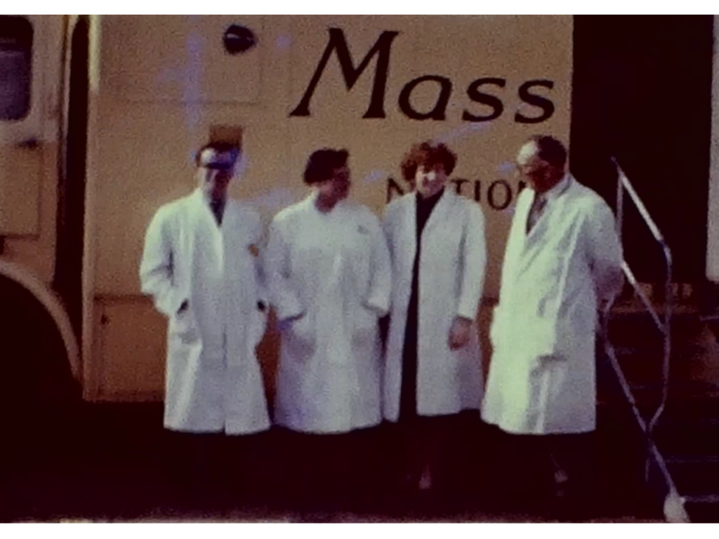 A Still image from a vintage home movie which shows a mobile X-Ray van in the town of St Andrews