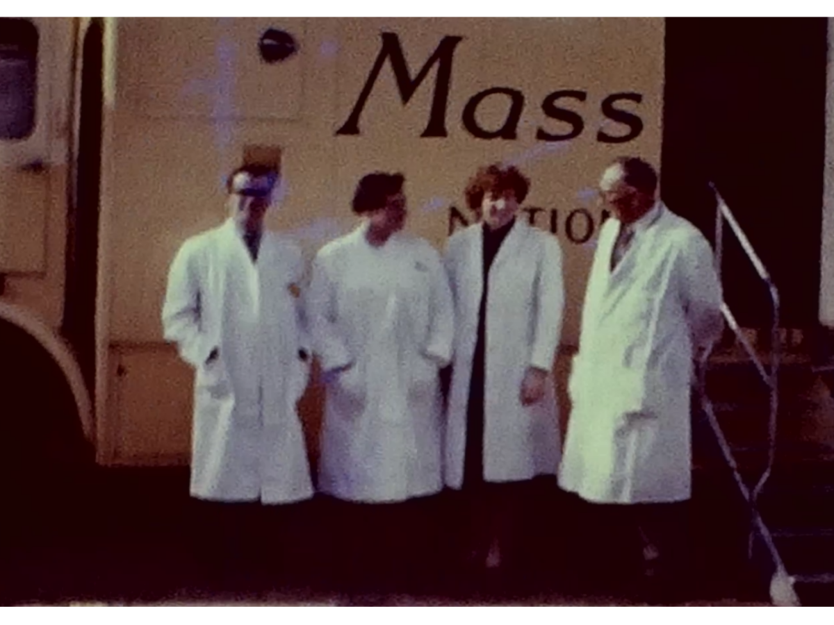 A Still image from a vintage home movie which shows a mobile X-Ray van in the town of St Andrews