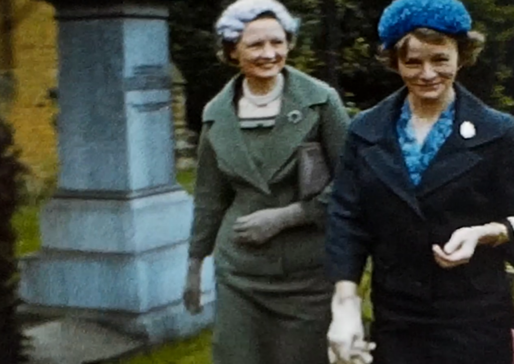 A still image from a 1960 vintage home movie which shows guests arriving at a possible society wedding