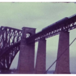A Still image from a vintage home movie showing the forth rail bridge