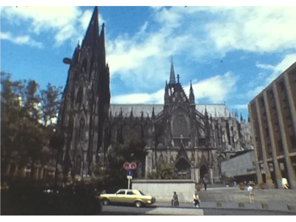 A still image of cologne cathedral in 1982 from a european river cruise vintage home movie