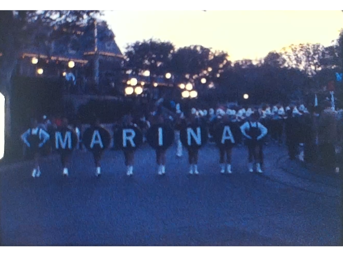 A Screen shot from a Super 8 Vintage Home Movie of a parade in the city of Marina in the USA in about 1975