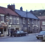 A still image from a vintage home movie shot in a village in Yorkshire in about 1970