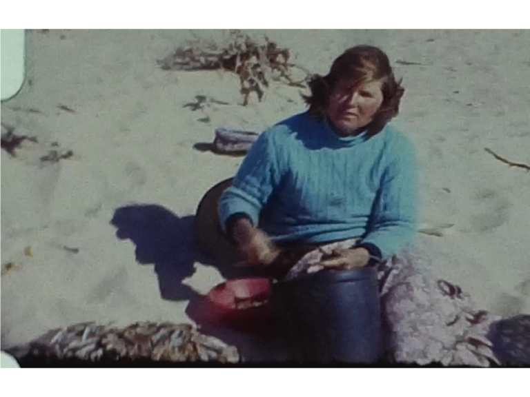 A Fisherwoman working on beach in Spain or Portugal