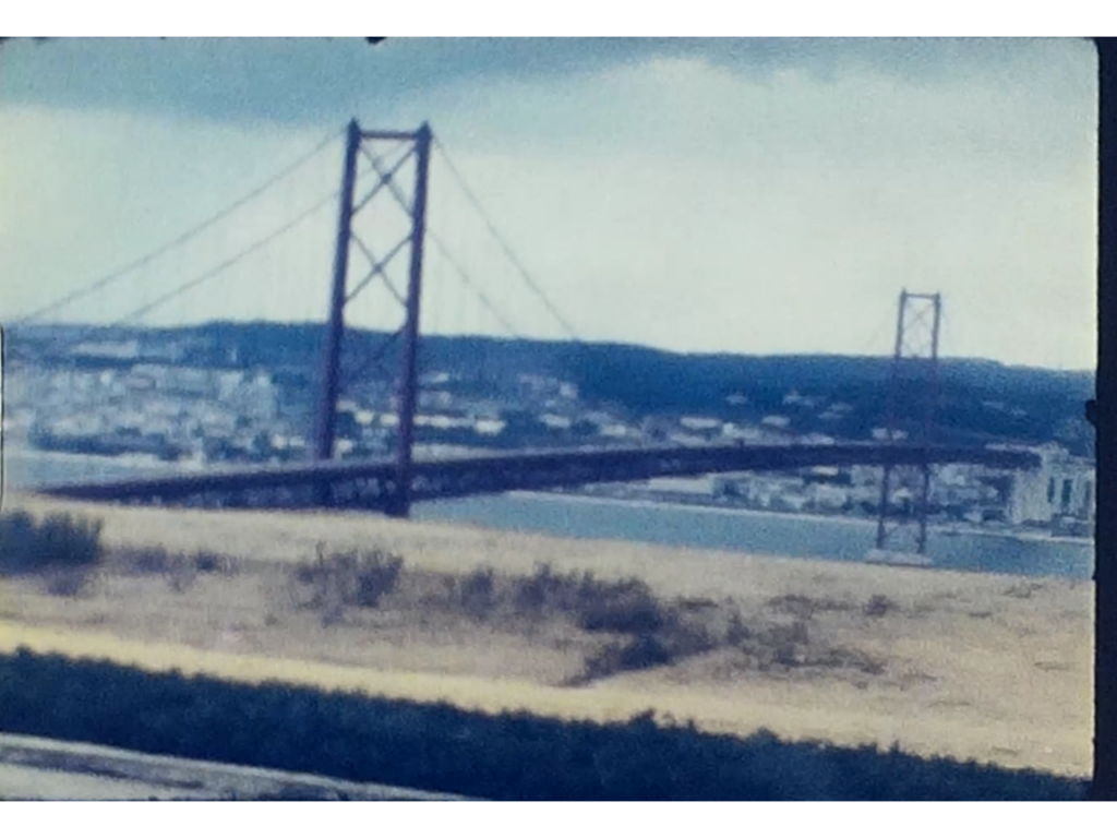 A photo of the 25 de Abril Bridge in Lisbon, Portugal from 1968