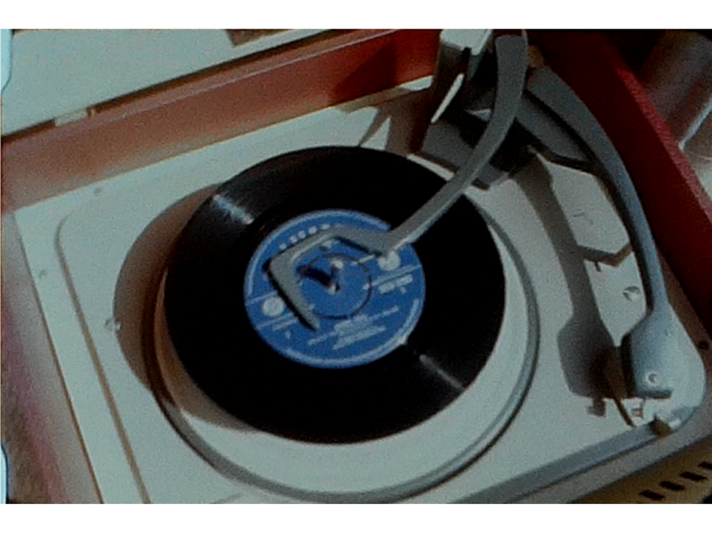 A still shop of a record player featured in an Avant-garde film from the 1960s