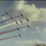 A shot taken from a super 8 home movie of the red arrows in a display from the 1970s
