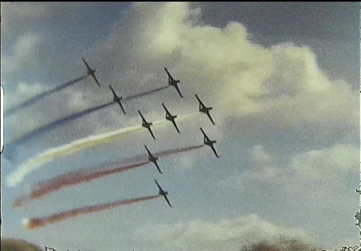 A shot taken from a super 8 home movie of the red arrows in a display from the 1970s