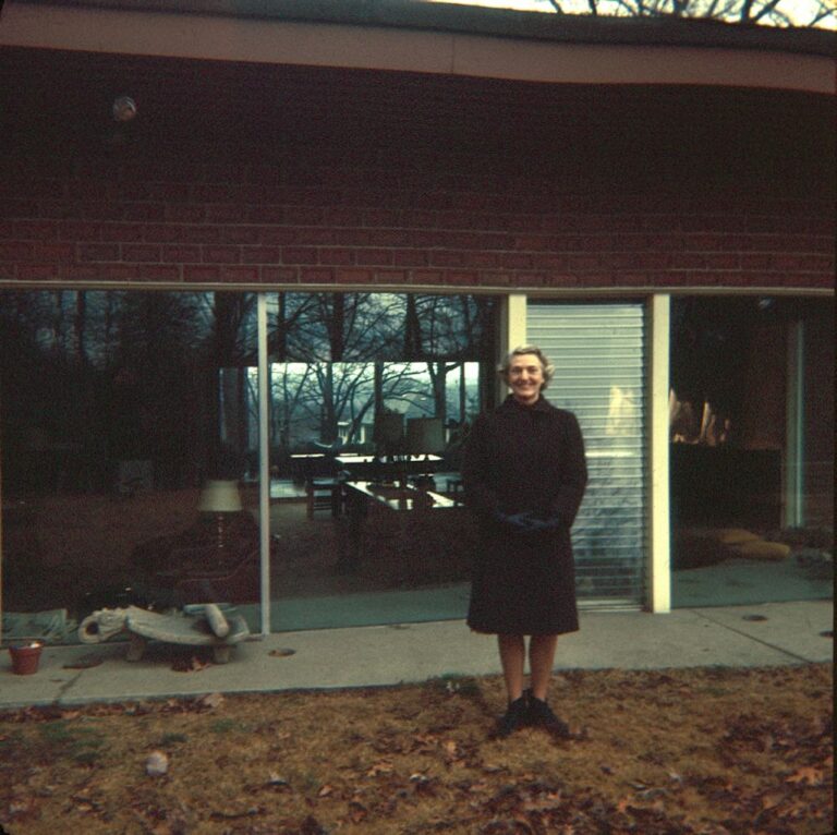 Portrait by a building from the 1960s