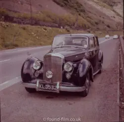 a fine old bentley mark iv car parked on the roadside