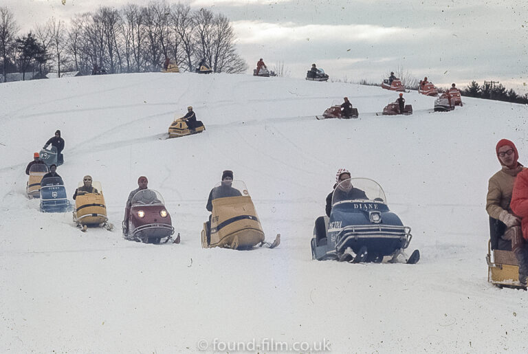 A line of snowmobiles