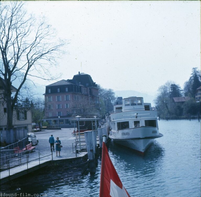 A Motor cruiser moored by the side of a river or canal