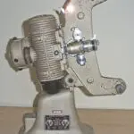 An image of a vintage Bell & Howell 8mm projector model 606H : Front side view of projector