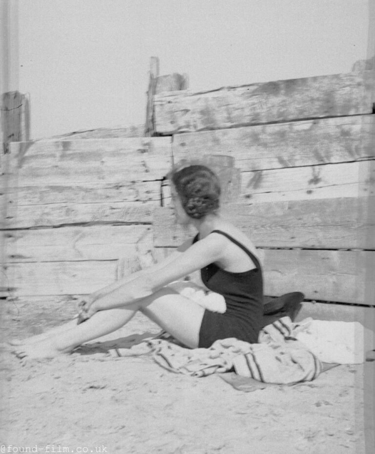 Black & White picture of a girl on a beach in about 1930