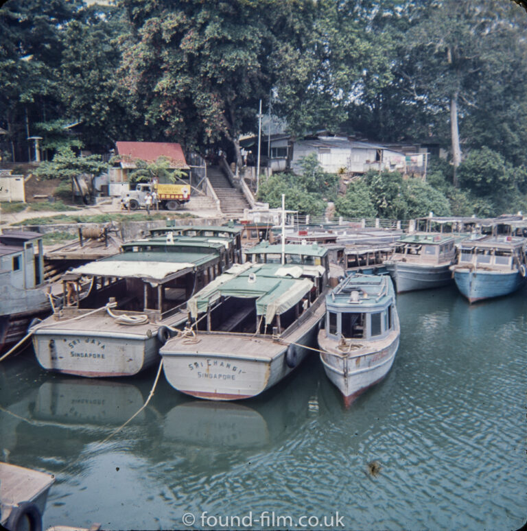 Boats moored on the river in Singapore in the early 1960s