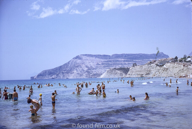 Bathers in the sea at Calpe beach in August 1971