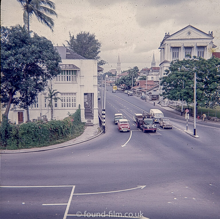 Some cars at a junction in Singapore c1960