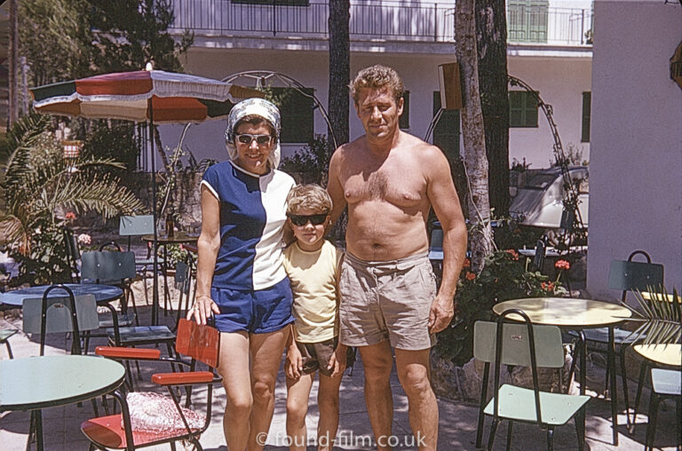 A couple on holiday with their child in July 1966