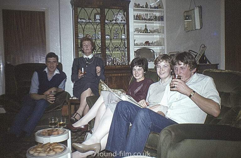 Family sitting on a sofa in a living room