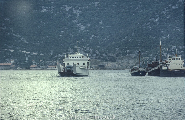 Ferry carrying a green lorry