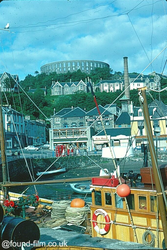 fishing boats distillery and tower and oban