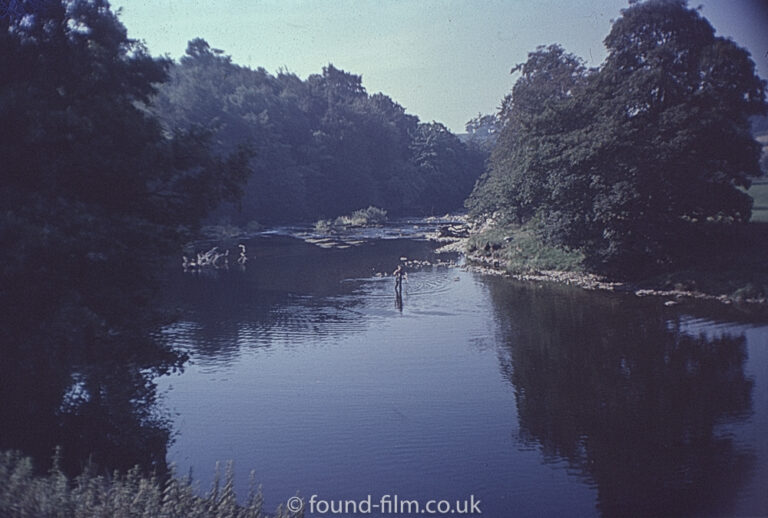 A man fishing in a river