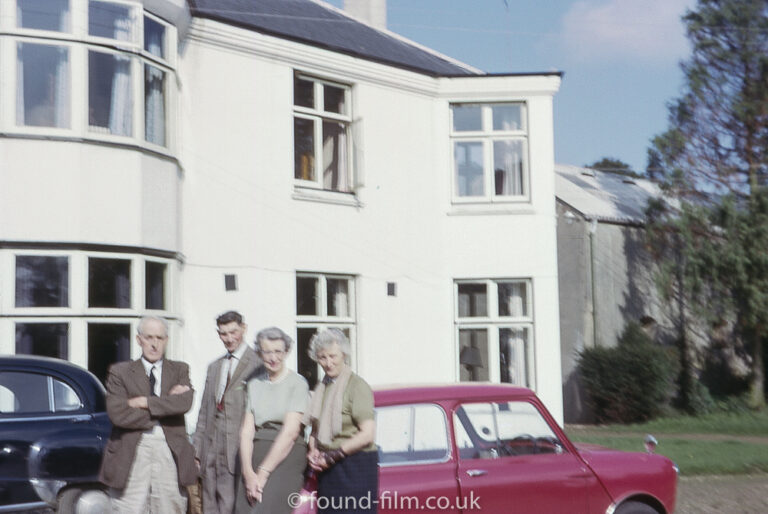 A family group outside their house