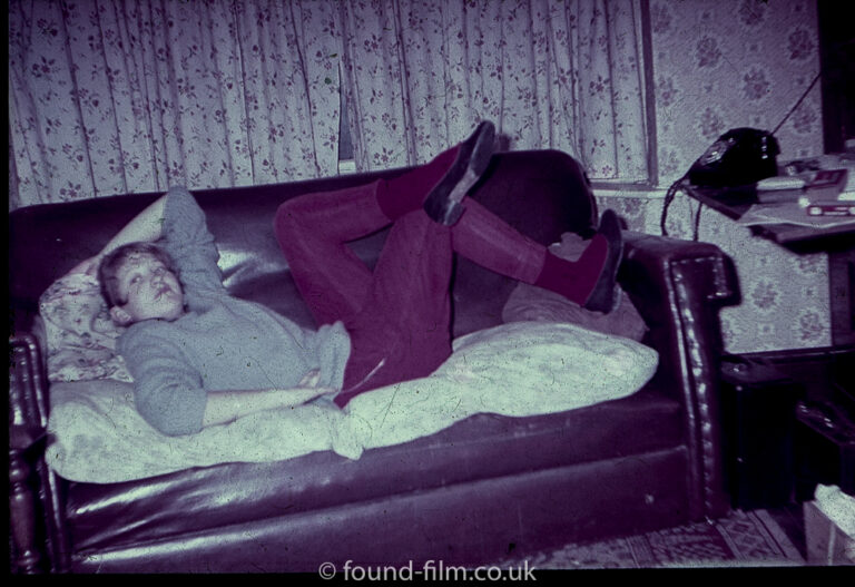 Girl on a sofa in a 1950s interior