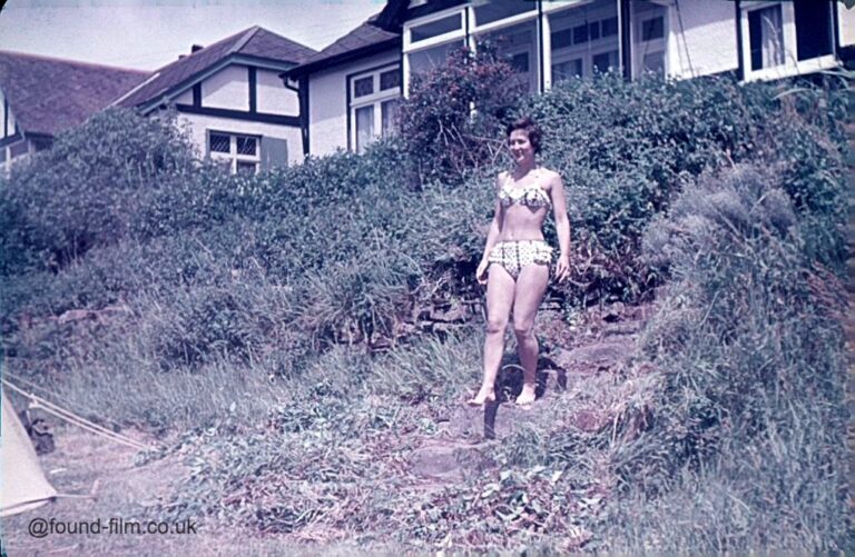 Girl walking down a path to a camping area