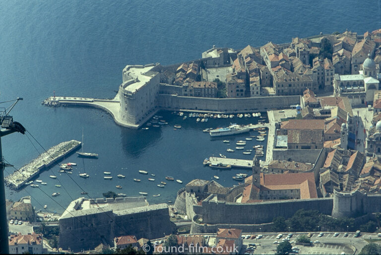 Picture looking down on a walled harbour