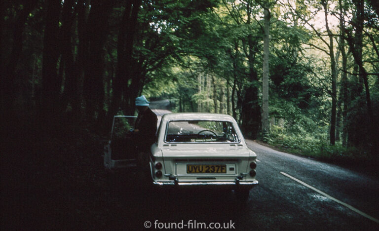 Hillman Imp coupe under trees