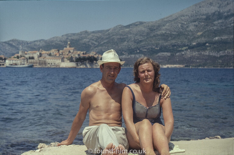 Holiday Snapshot of a couple sitting on a rock