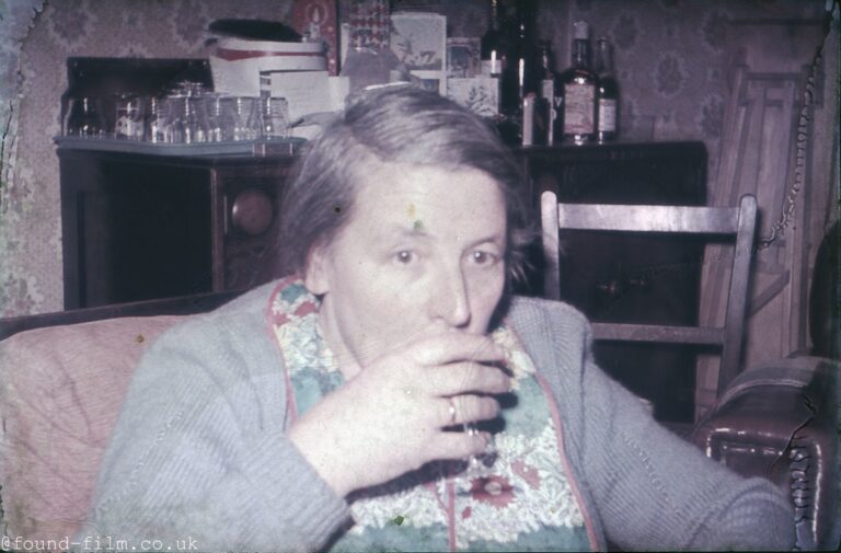 Lady having a quiet drink c1955