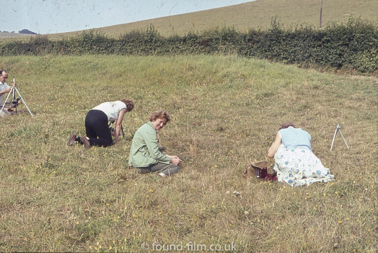 A group of photographers practising macro photography